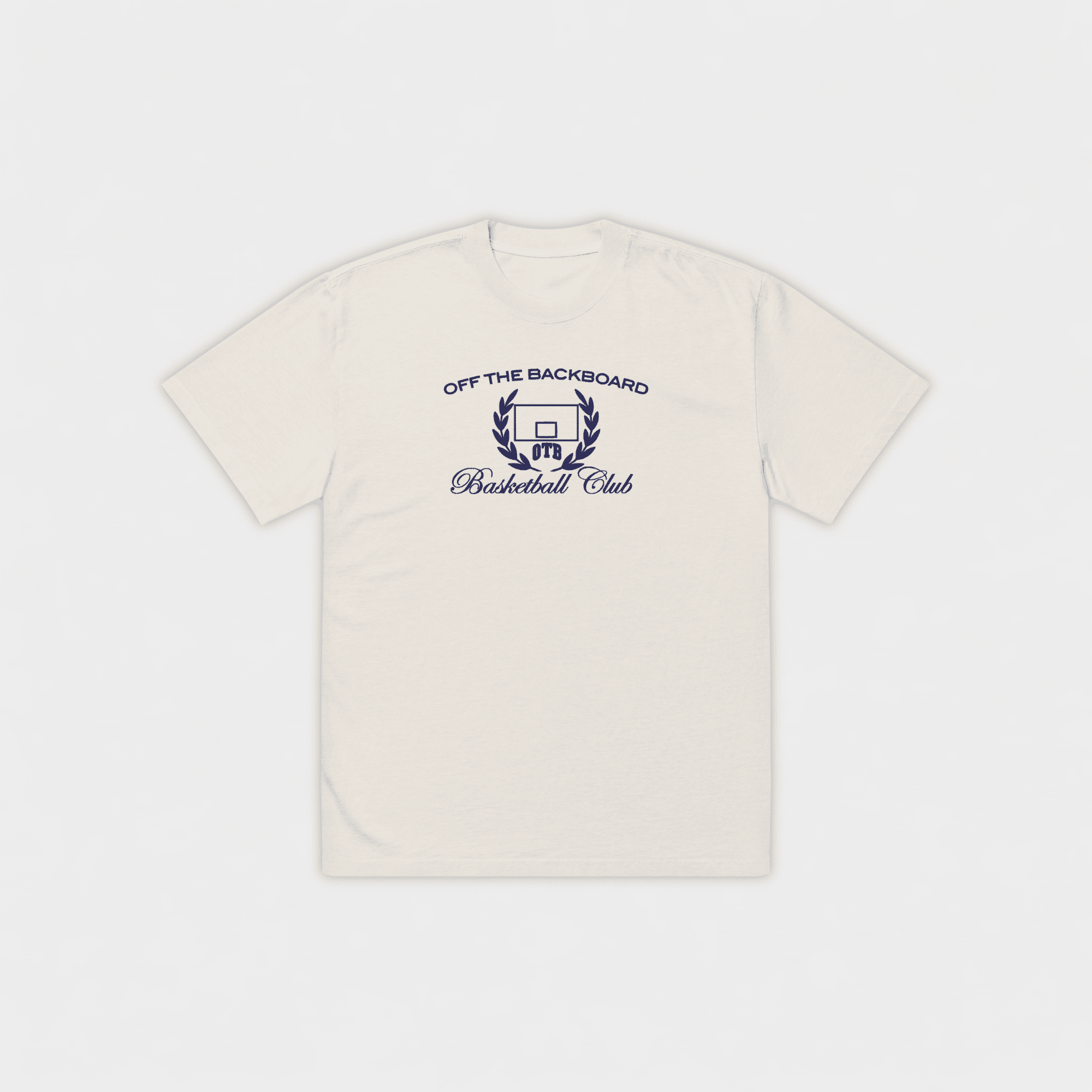 Beige t-shirt with 'Off the Backboard Basketball Club' logo on a white background