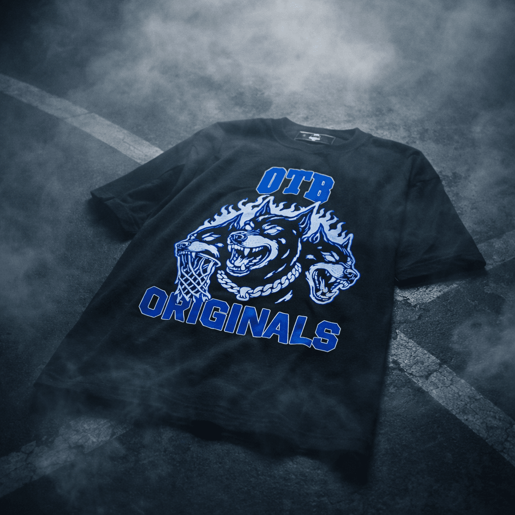 Black t-shirt with blue graphic design on a textured surface