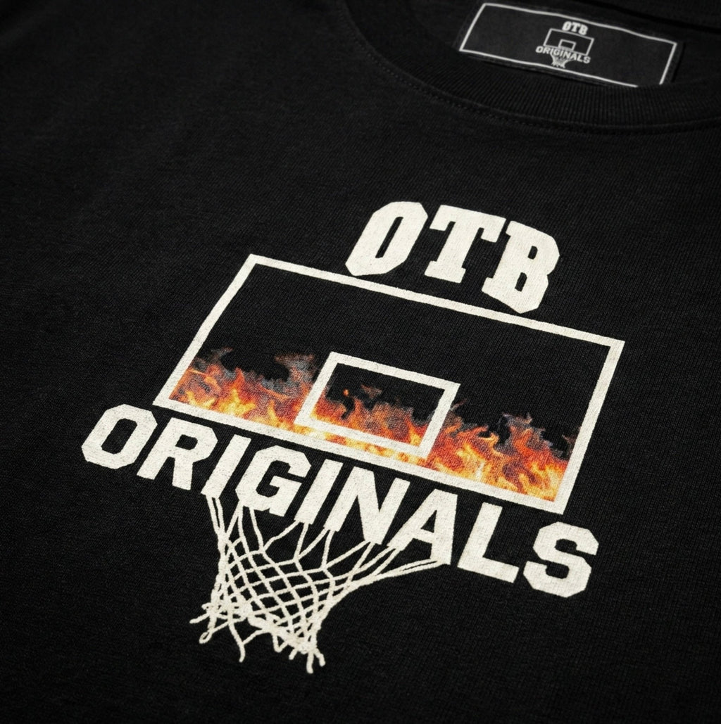 Black t-shirt with 'OTB Originals' graphic featuring a flaming basketball hoop and net.