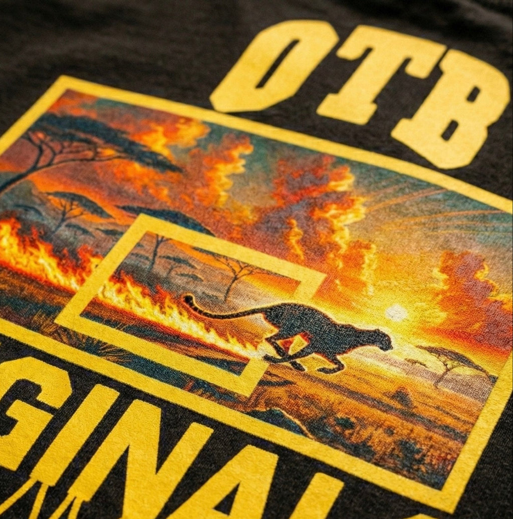 Black t-shirt with a graphic of a panther running through flames and 'OTB Original' text.